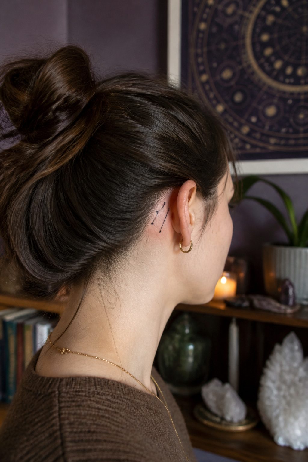 Constellation tattoo behind a model's ear with black dots and lines.