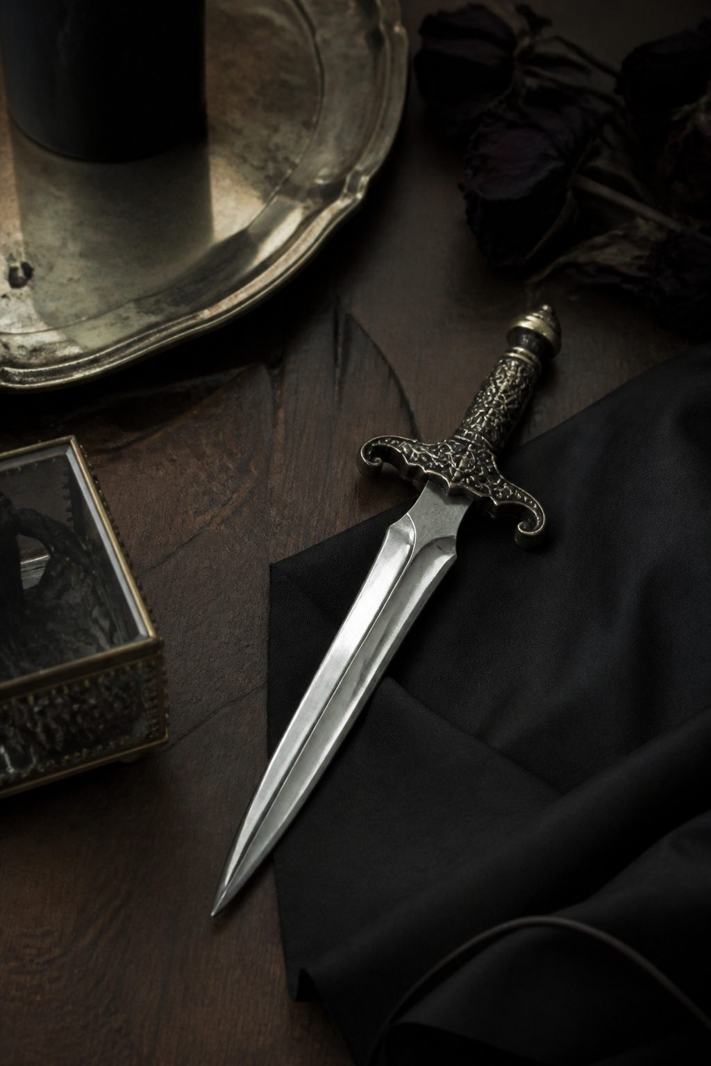 A tattoo of a sharp dagger with no blood.
