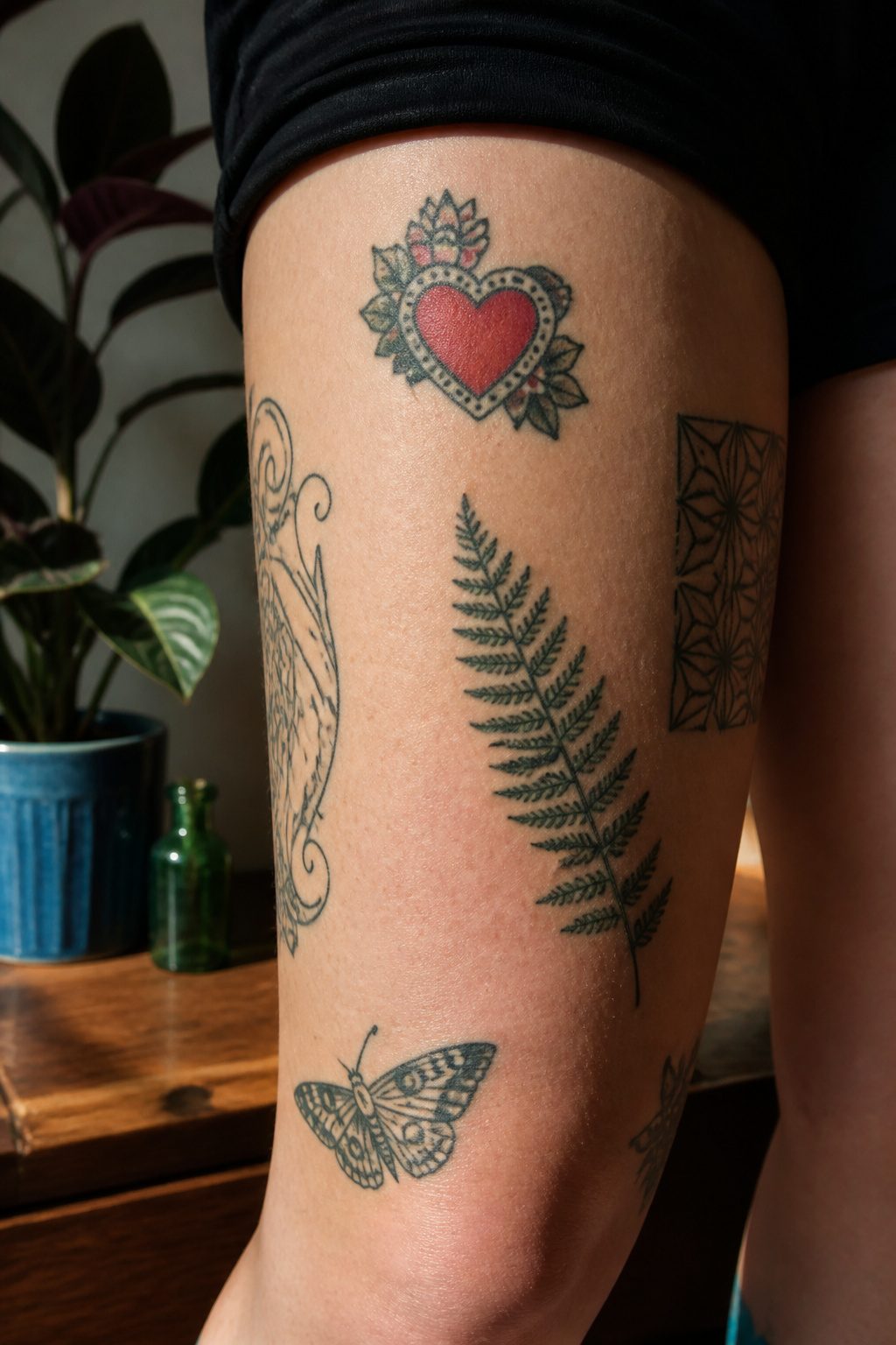 Patchwork Tattoos: Planning, Styles, Placements & Cost Guide 2026 1 Bare skin displaying a collection of different tattoos in negative space.